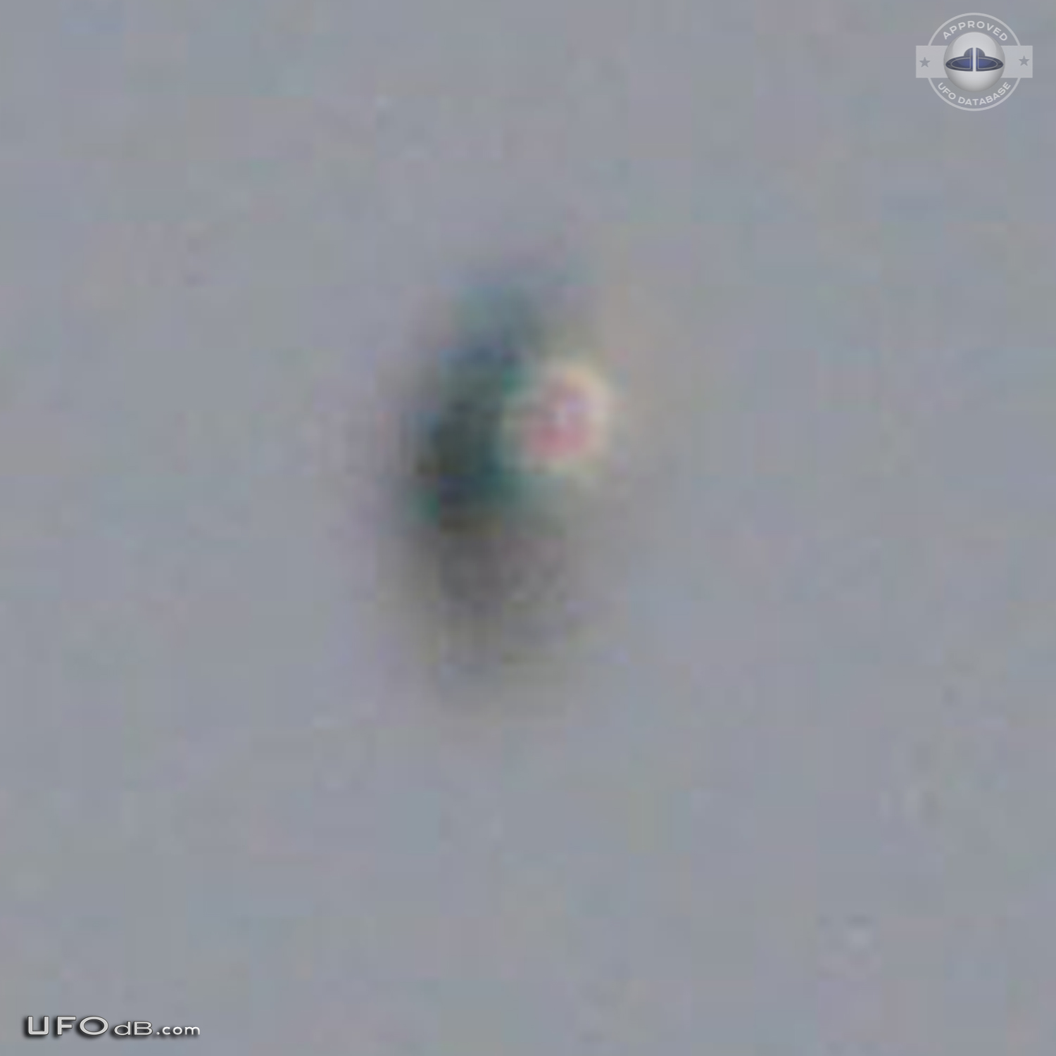 Shiny Upside-down Teardrop UFO rotating in the sky San Marcos CA USA UFO Picture #623-4