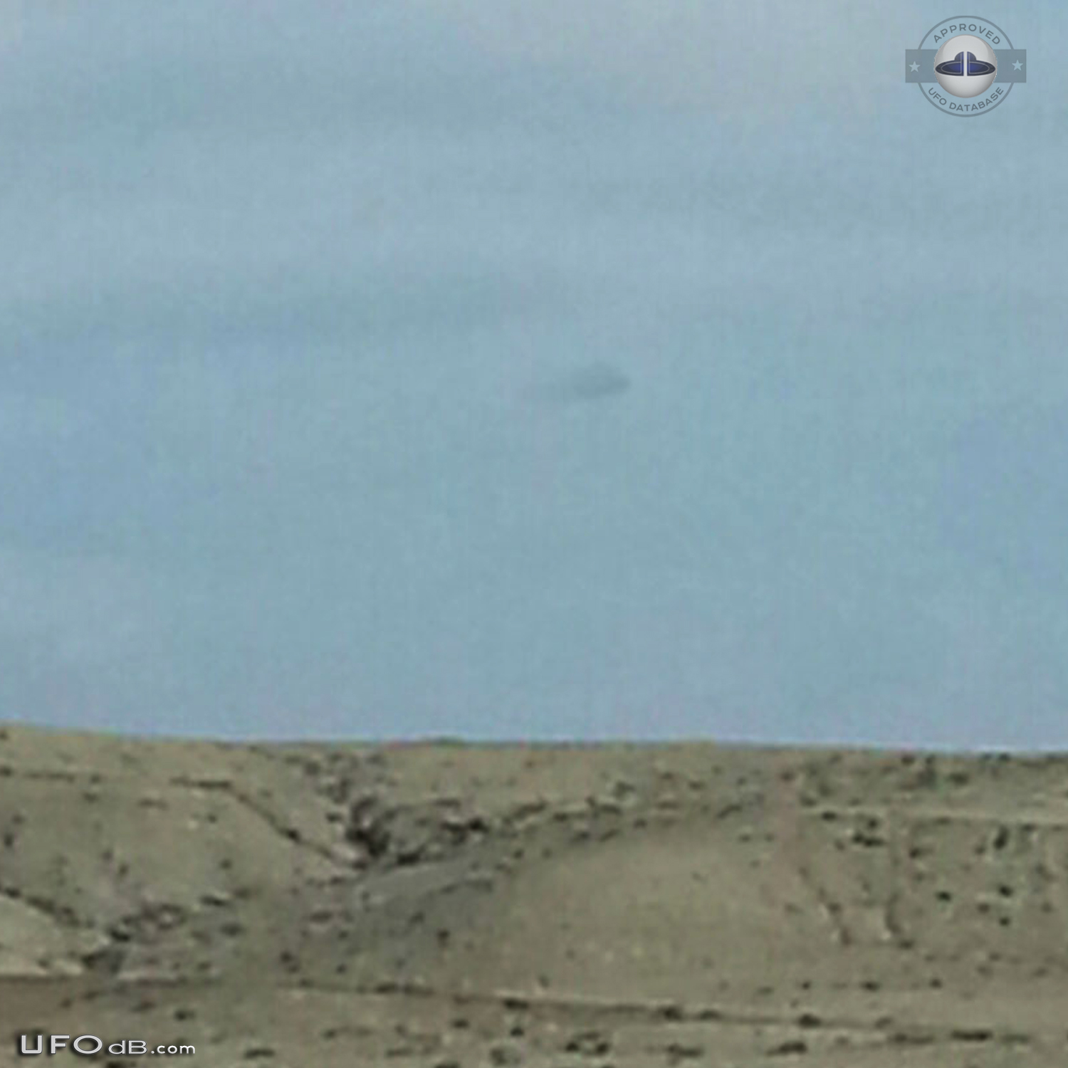 Cigar shaped UFO hiding in out of clouds in Farmington New Mexico USA UFO Picture #625-2