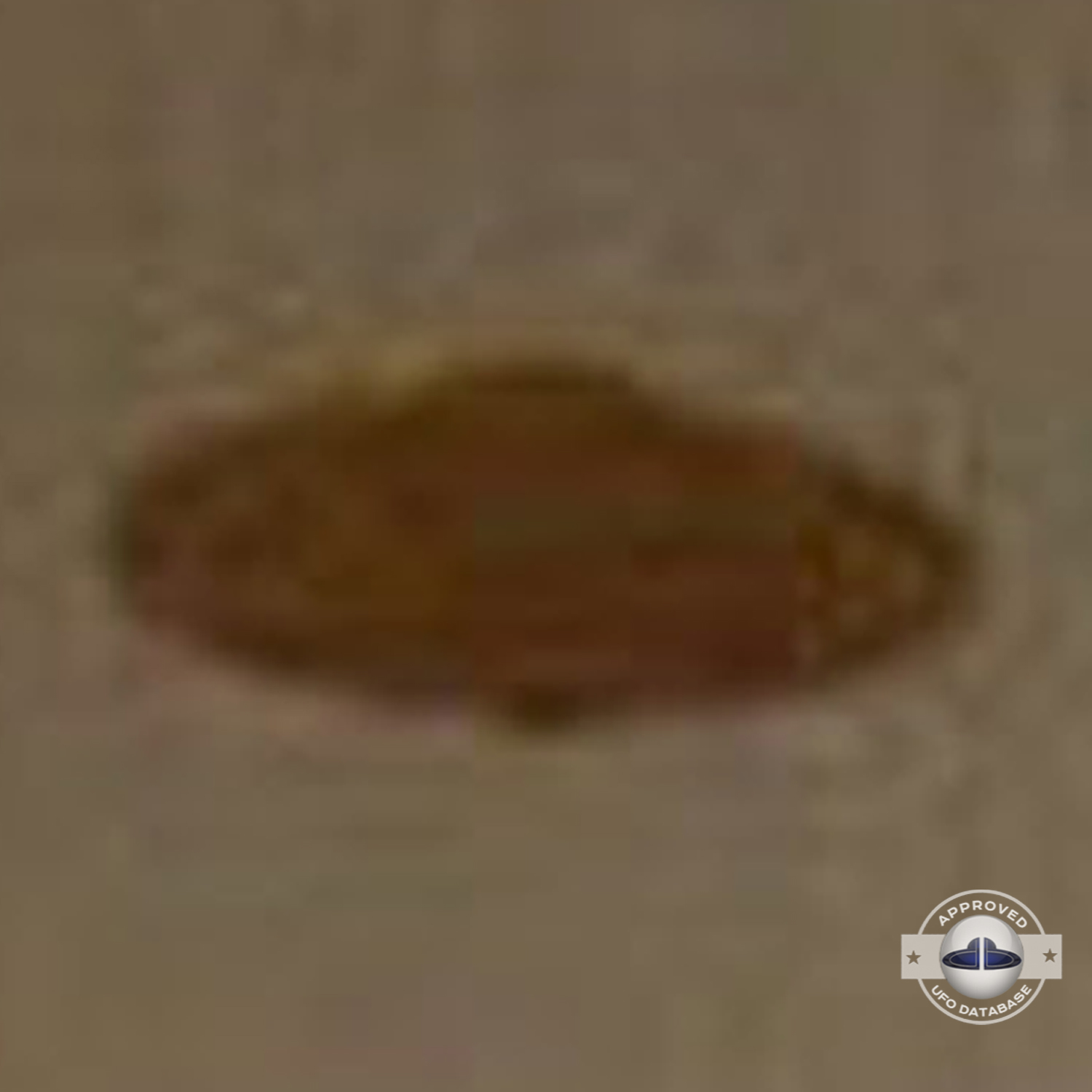The UFO has a Saturn shape and can be seen at nightfall over a house UFO Picture #65-5