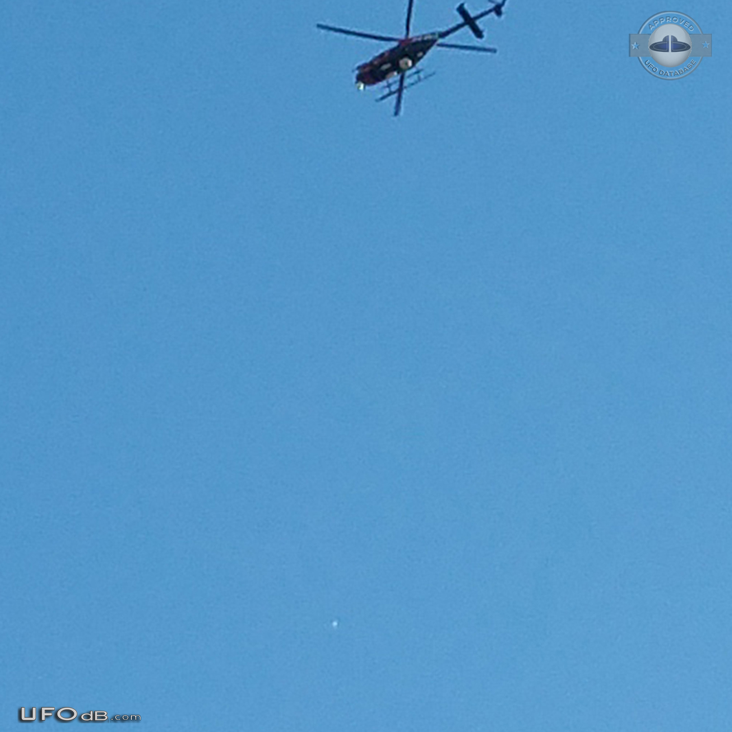 heard a helicopter and looked up and saw a shiny ball that was moving UFO Picture #672-3