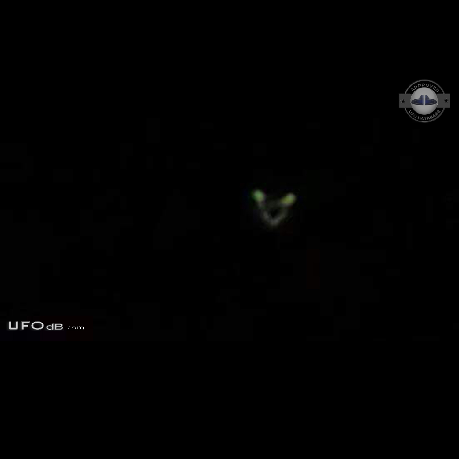 Circular UFO with 2 glowing green lights seen in Huddersfield UK 2011 UFO Picture #688-1