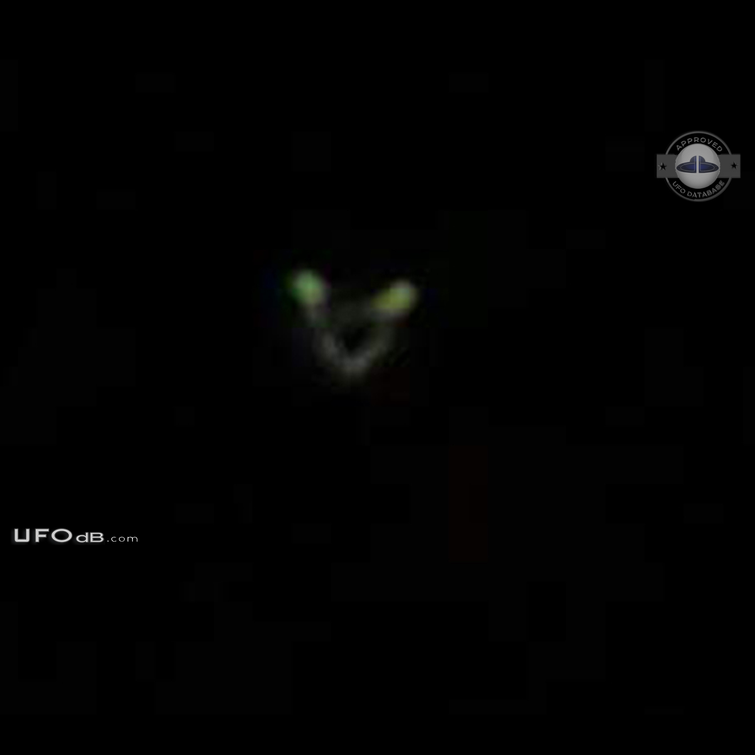 Circular UFO with 2 glowing green lights seen in Huddersfield UK 2011 UFO Picture #688-2