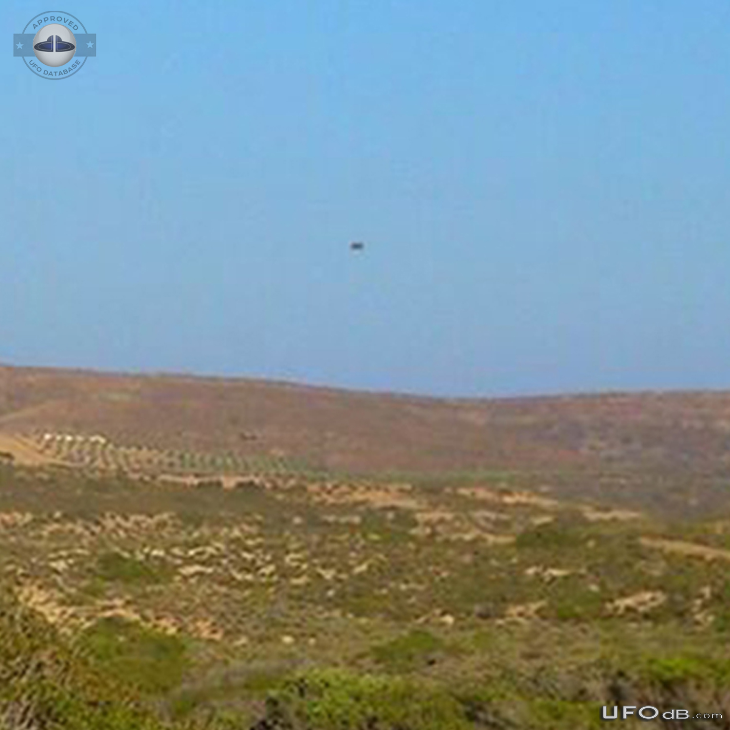 Grey saucer UFO caught on picture over Sitia, Crete Greece in 2014 UFO Picture #697-3