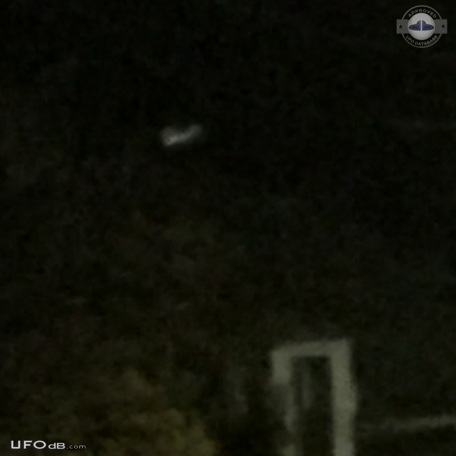 Looked like mothership with smaller glowing craft flying around it in  UFO Picture #708-3