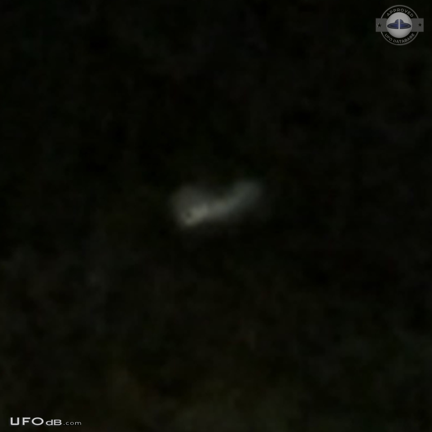 Looked like mothership with smaller glowing craft flying around it in  UFO Picture #708-4