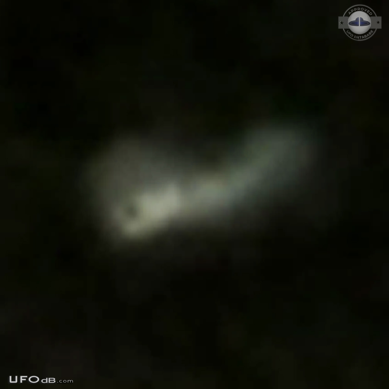 Looked like mothership with smaller glowing craft flying around it in  UFO Picture #708-5