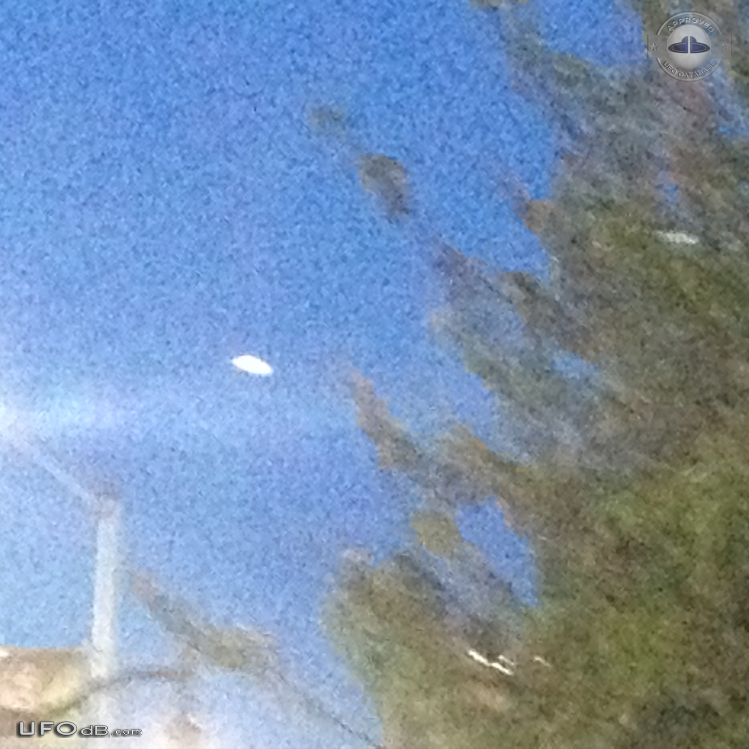 Luminescent dome shaped UFO with red light at its base Los Angeles USA UFO Picture #730-1