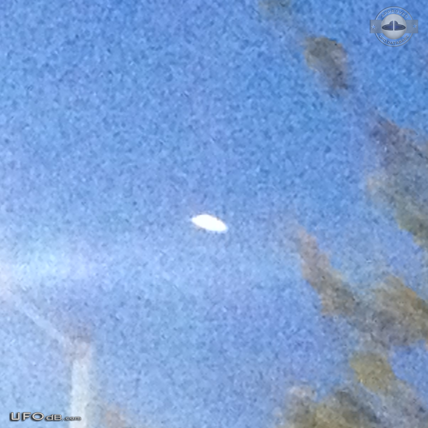 Luminescent dome shaped UFO with red light at its base Los Angeles USA UFO Picture #730-3