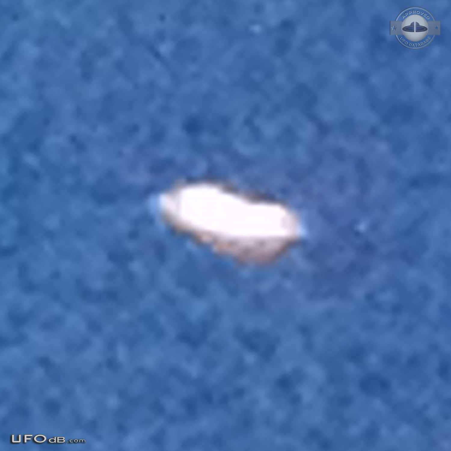 Luminescent dome shaped UFO with red light at its base Los Angeles USA UFO Picture #730-6