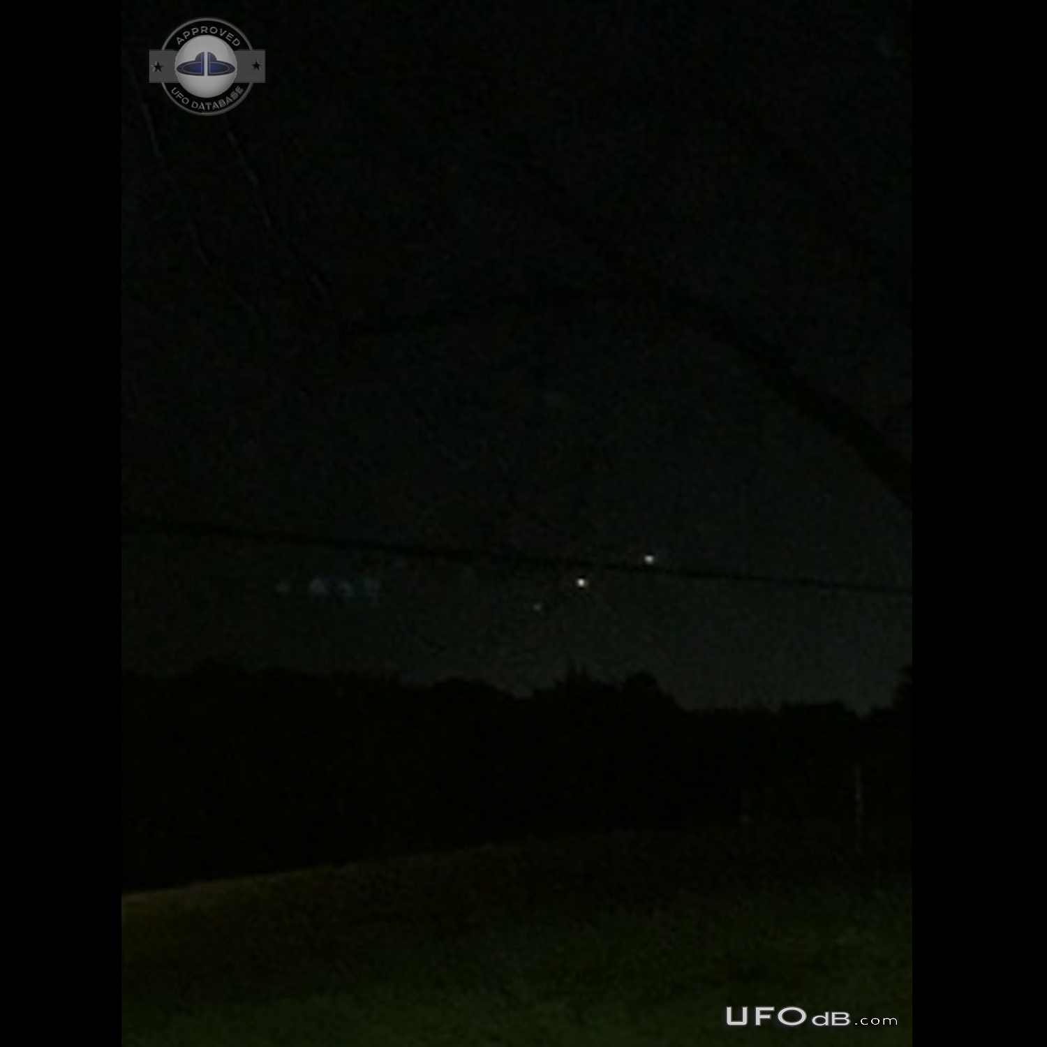 Perfect line of hovering UFOs low to ground - Hazelwood Missouri 2015 UFO Picture #737-1