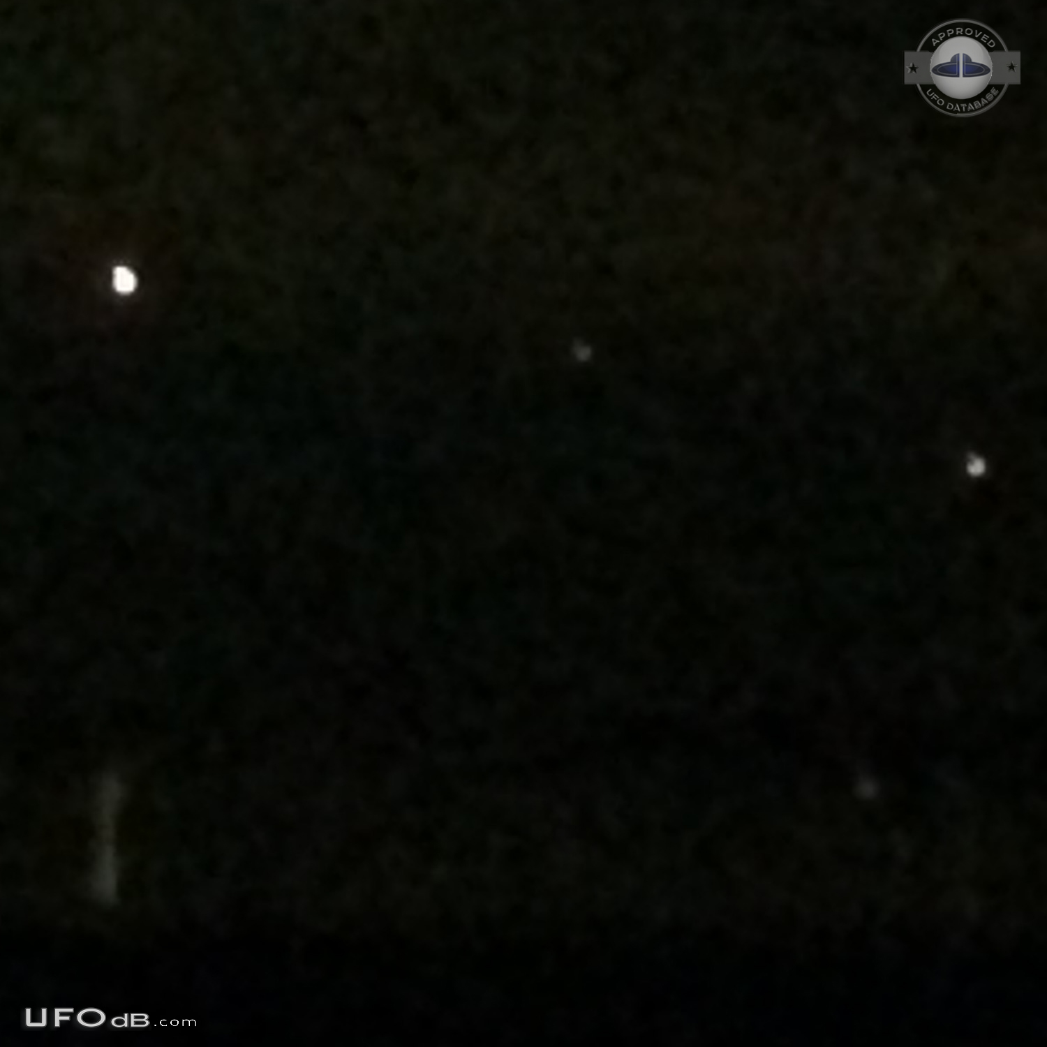 Yellowish-white UFOs with hints of red at center hovered - Clinton Was UFO Picture #755-3