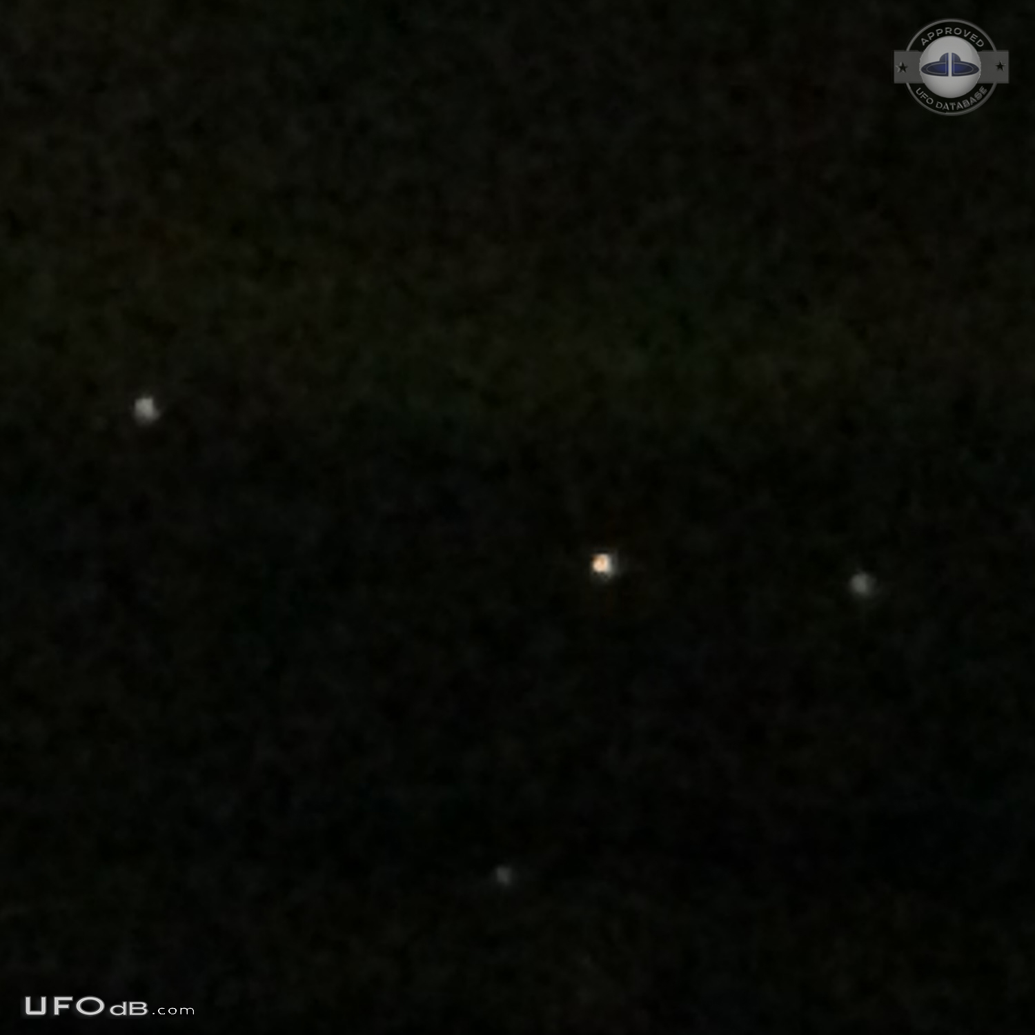 Yellowish-white UFOs with hints of red at center hovered - Clinton Was UFO Picture #755-5