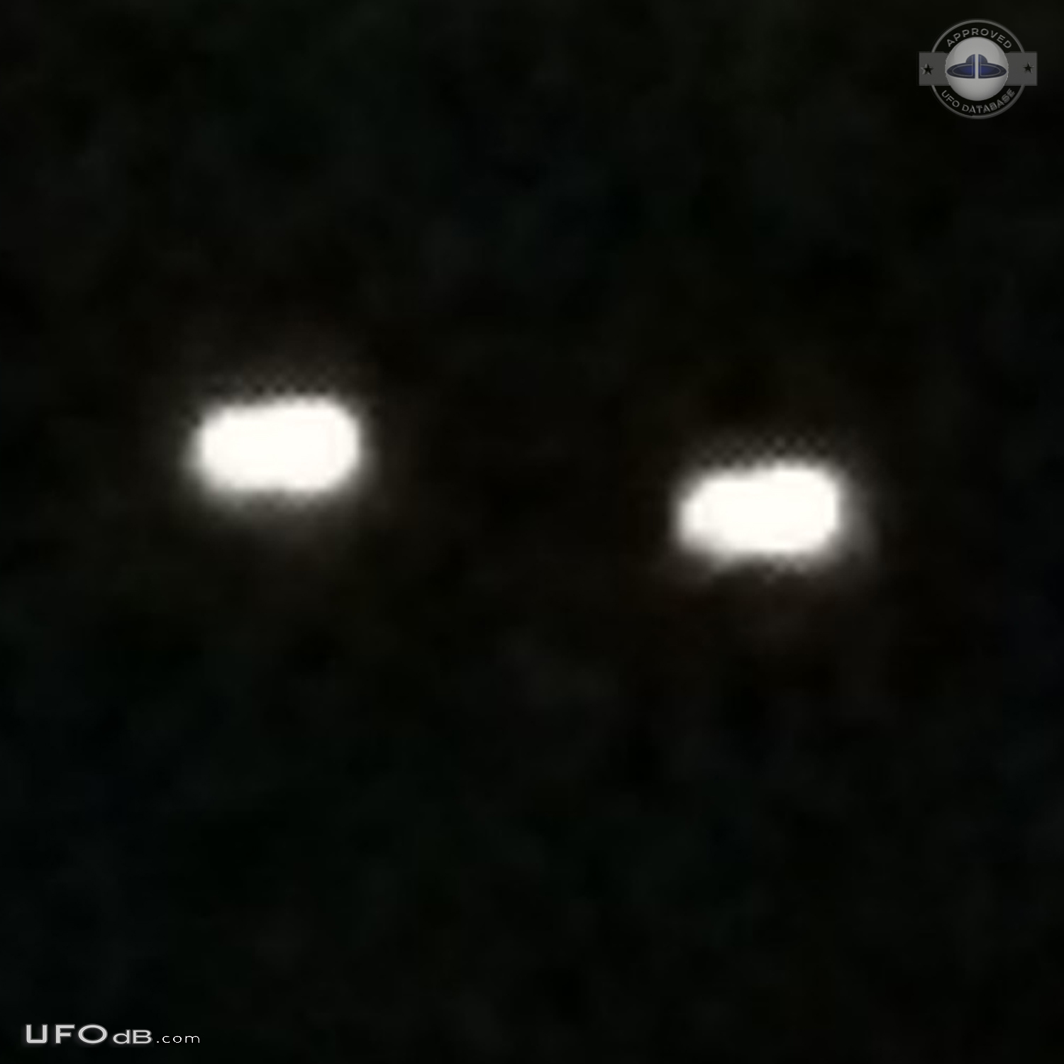 Yellowish-white UFOs with hints of red at center hovered - Clinton Was UFO Picture #755-6