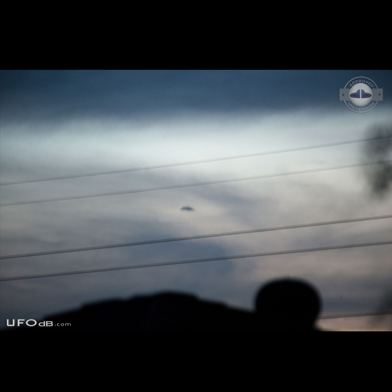 Hovering disc UFO moved then disappeared in the clouds Brisbane Queens UFO Picture #776-1