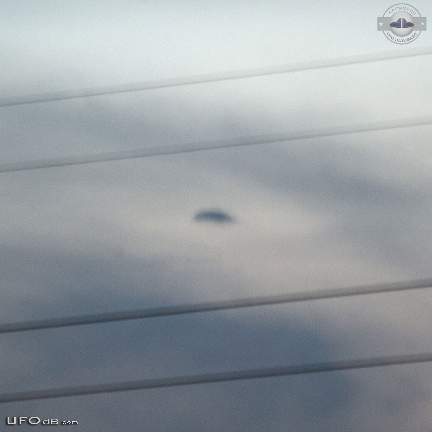 Hovering disc UFO moved then disappeared in the clouds Brisbane Queens UFO Picture #776-3