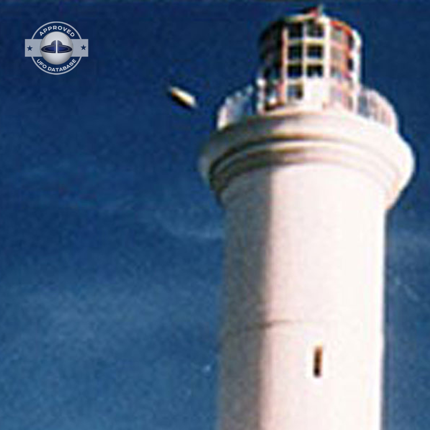 The first ufo can be seen clearly as it passed near old lighthouse UFO Picture #79-3