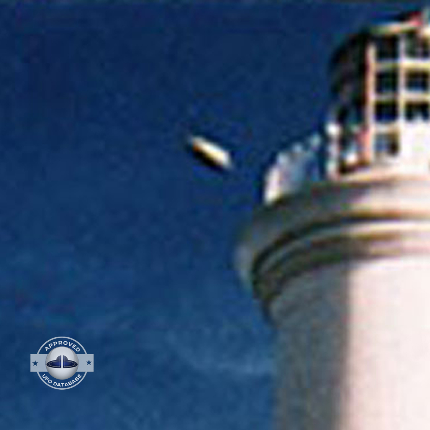 The first ufo can be seen clearly as it passed near old lighthouse UFO Picture #79-4