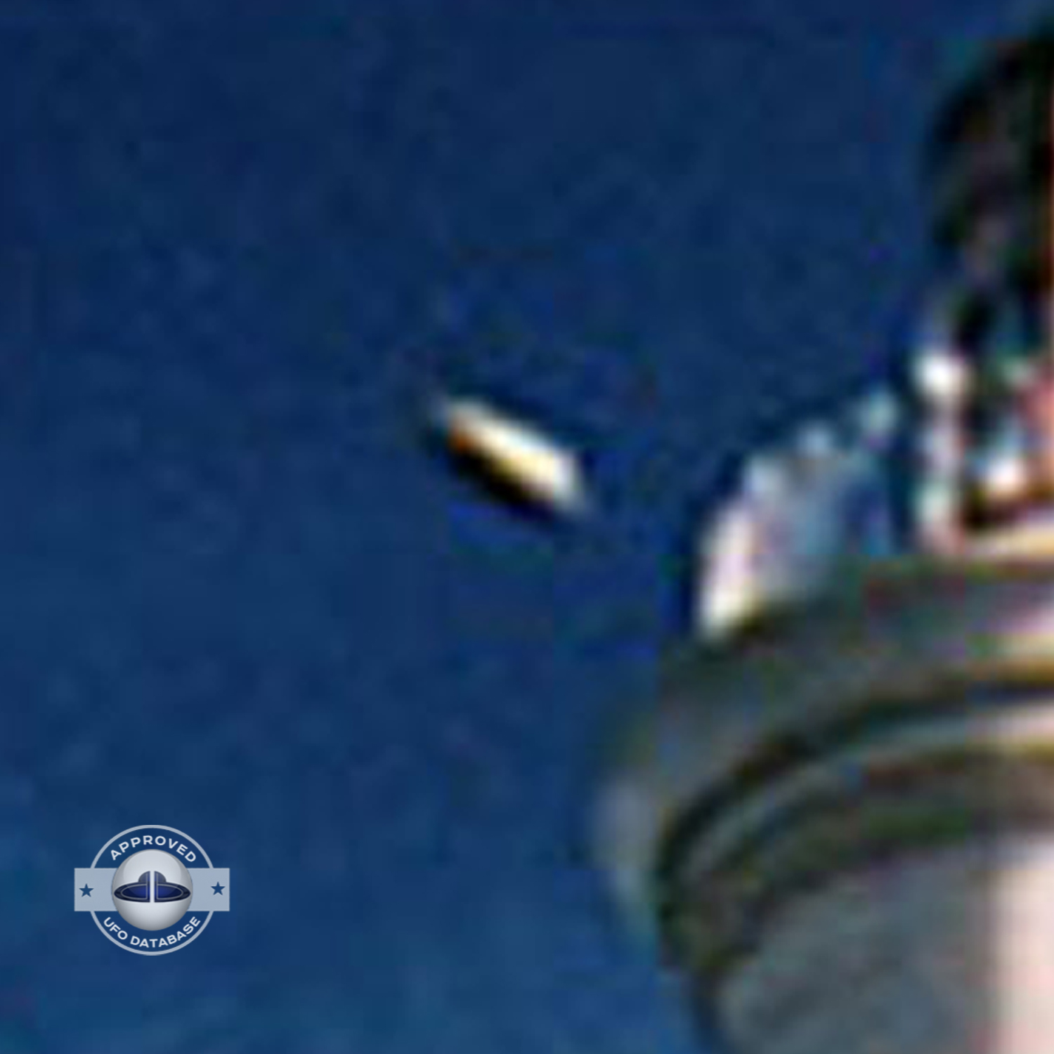 The first ufo can be seen clearly as it passed near old lighthouse UFO Picture #79-5