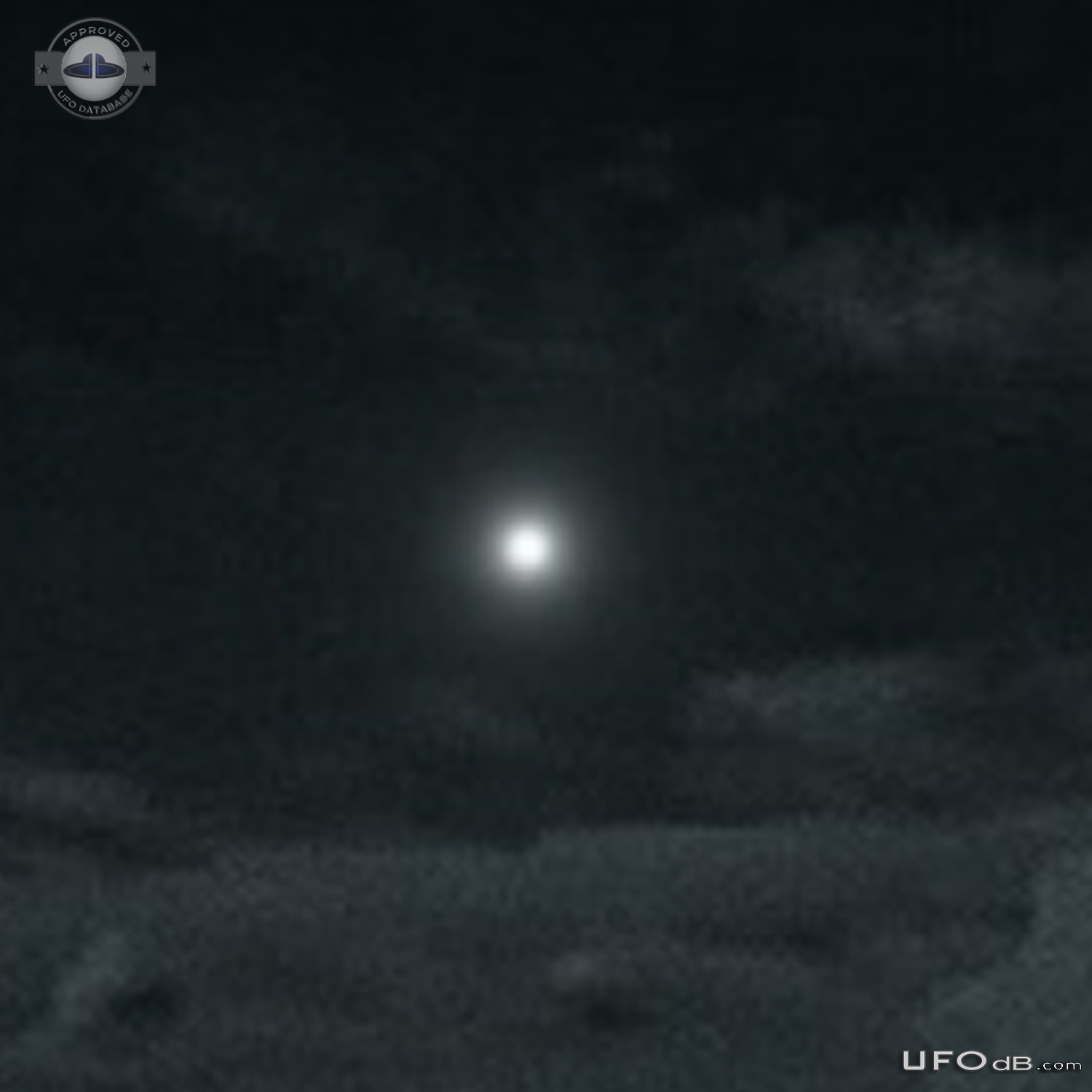 Bright white light UFO hovered continued on path then quickly faded ou UFO Picture #796-3