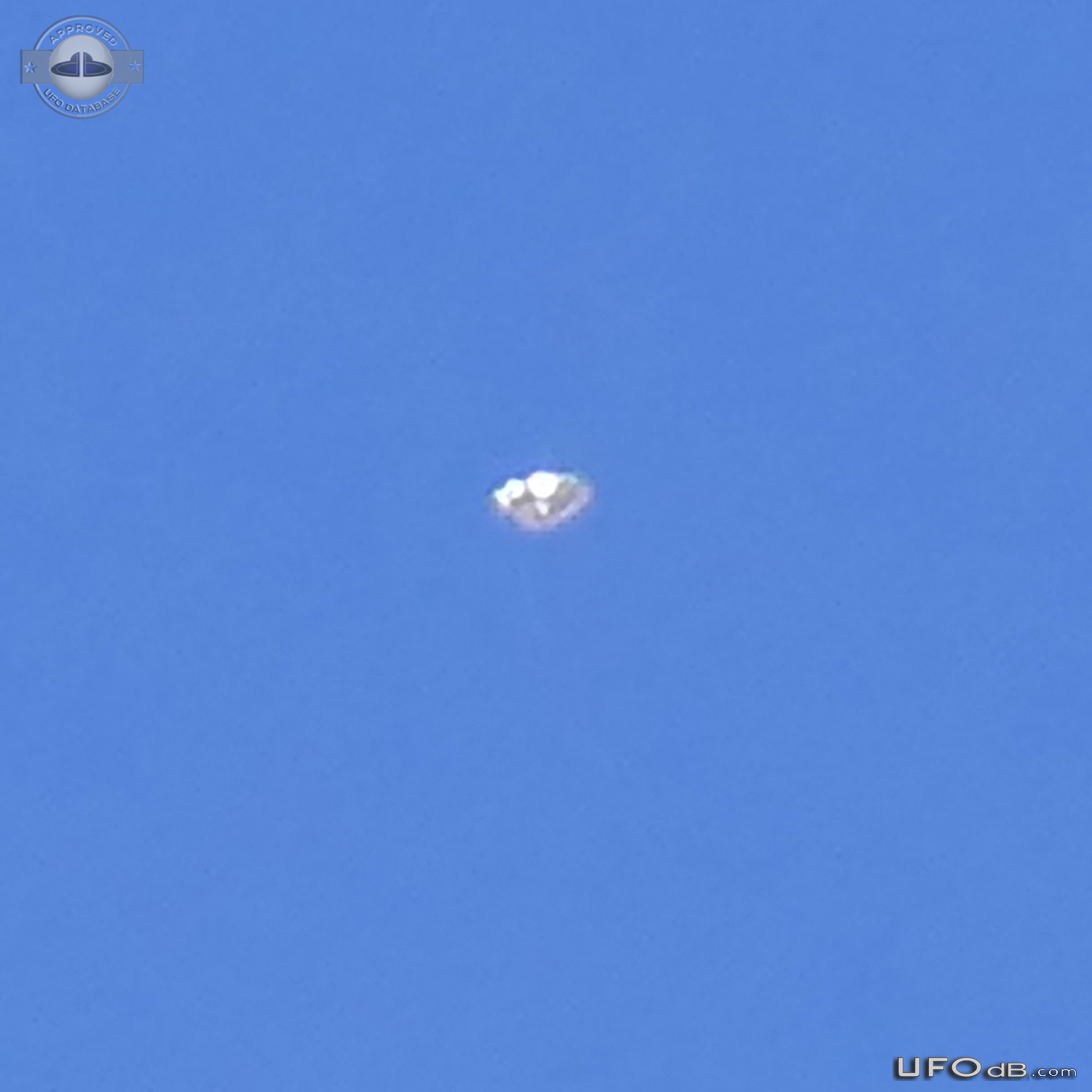 Looked up at a high altitude jet stream, saw a glint UFO shinning Ariz UFO Picture #809-2