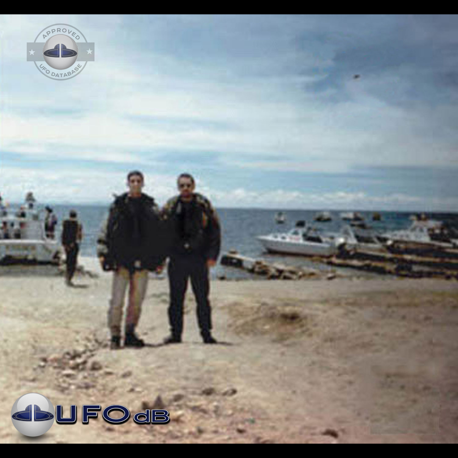 While taking a picture of 2 persons near lake Titicaca, capture a UFO UFO Picture #82-1