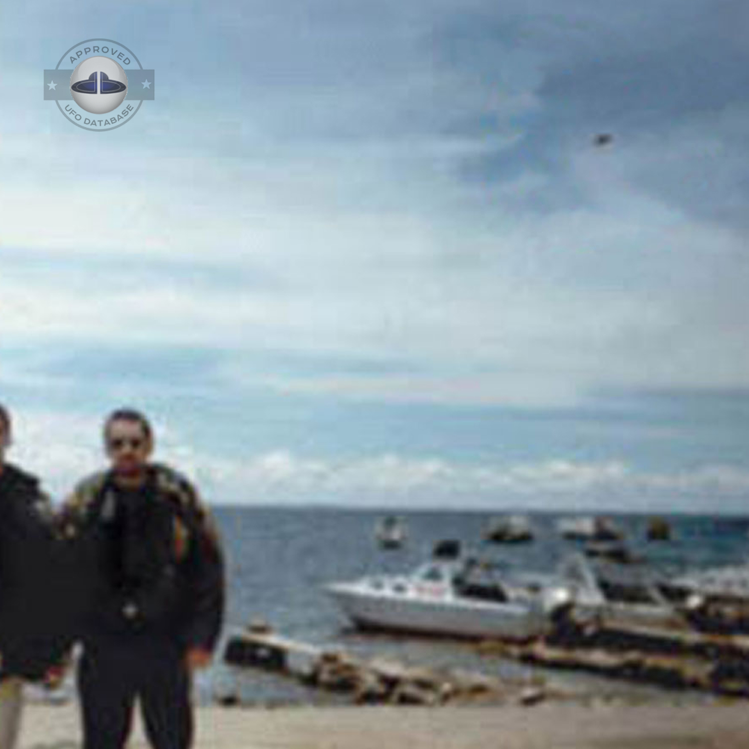 While taking a picture of 2 persons near lake Titicaca, capture a UFO UFO Picture #82-2