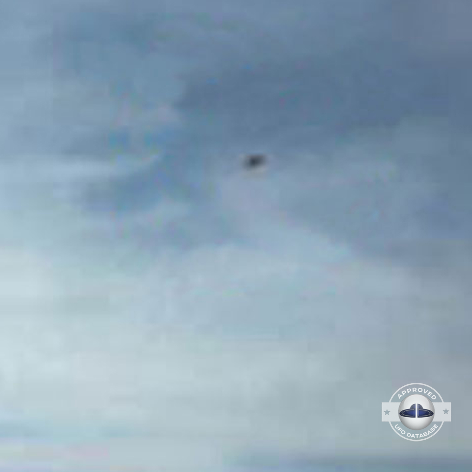 While taking a picture of 2 persons near lake Titicaca, capture a UFO UFO Picture #82-3