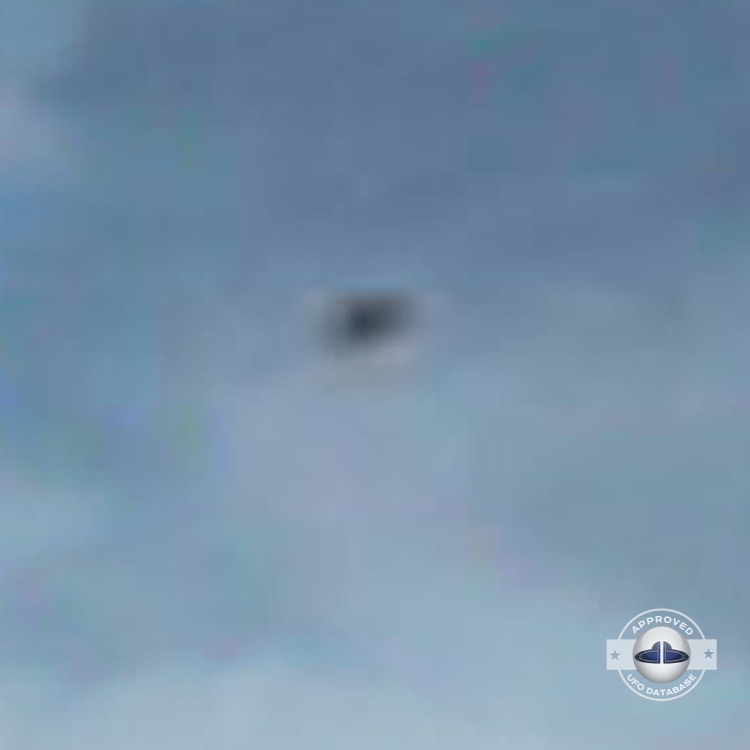 While taking a picture of 2 persons near lake Titicaca, capture a UFO UFO Picture #82-4