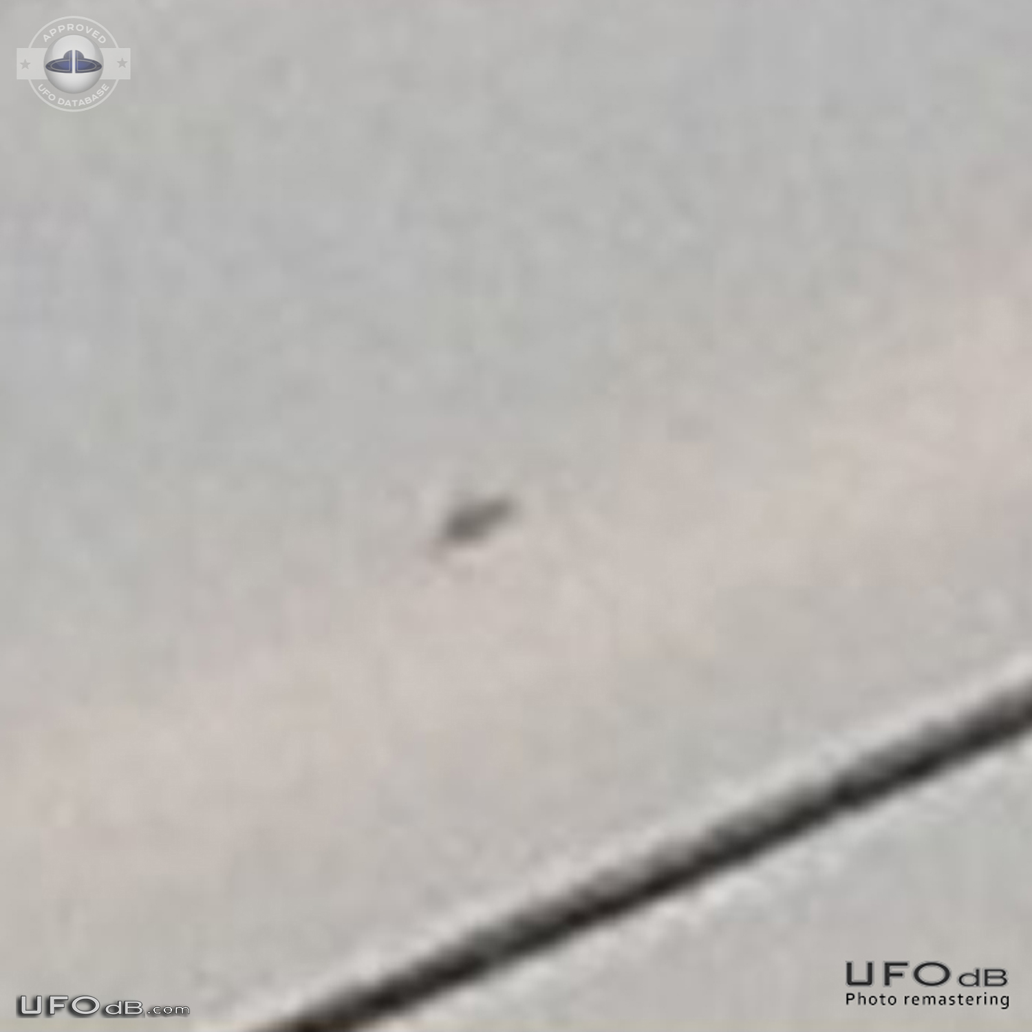 Stationary black orb observed while stuck in traffic in Aurora Colorad UFO Picture #848-3