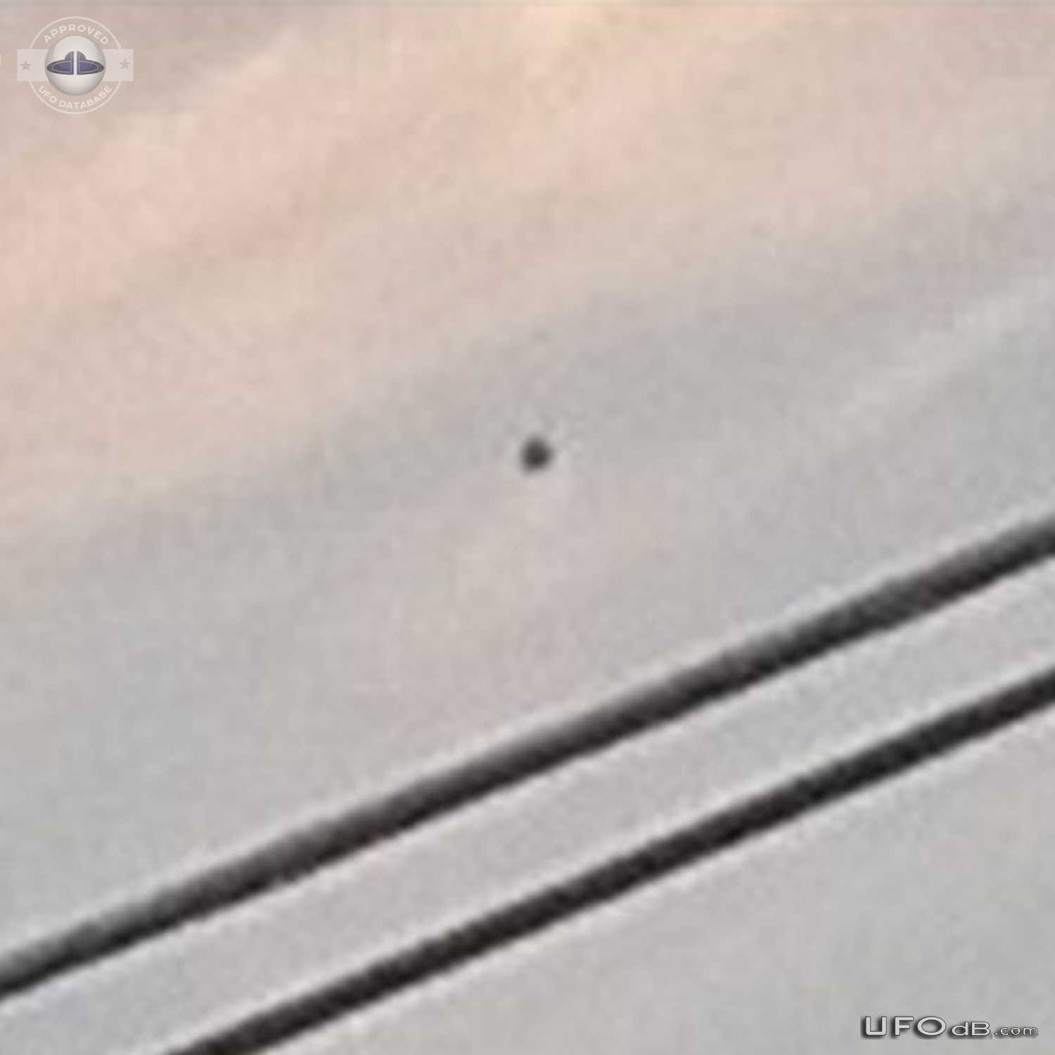 Stationary black orb observed while stuck in traffic in Aurora Colorad UFO Picture #848-4