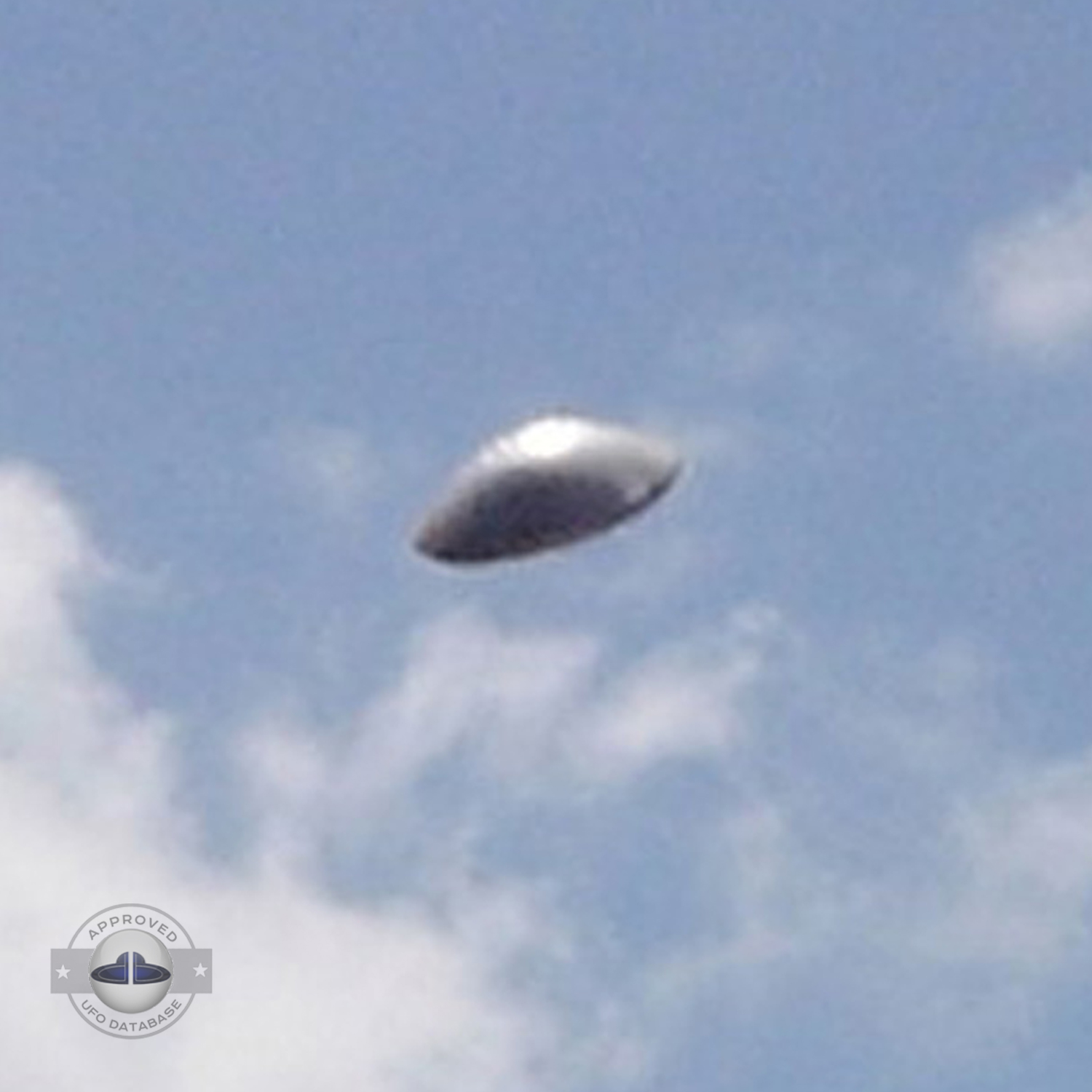 UFO with silver dome shape in clear blue sky. UFO picture Alagamar UFO Picture #86-3