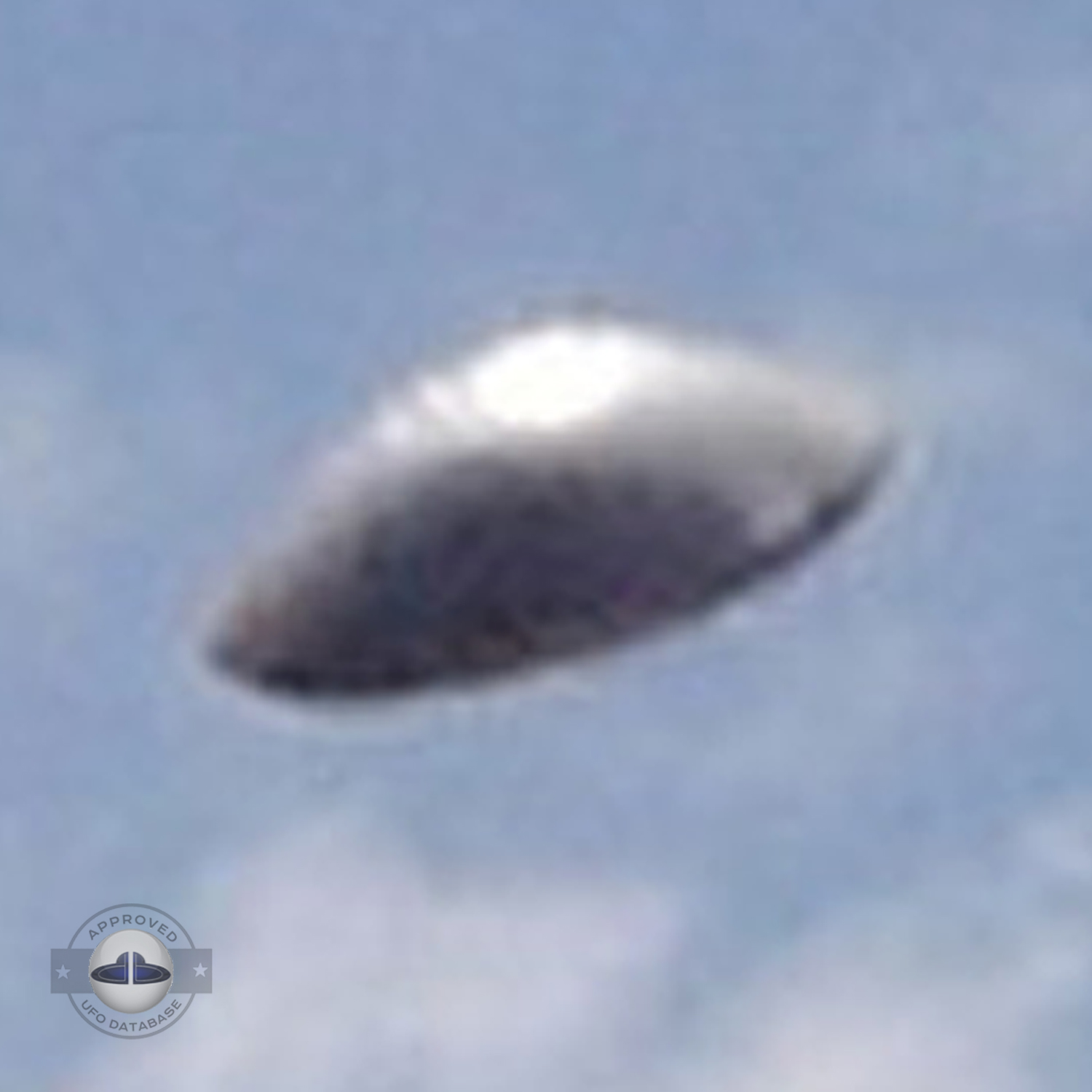 UFO with silver dome shape in clear blue sky. UFO picture Alagamar UFO Picture #86-4