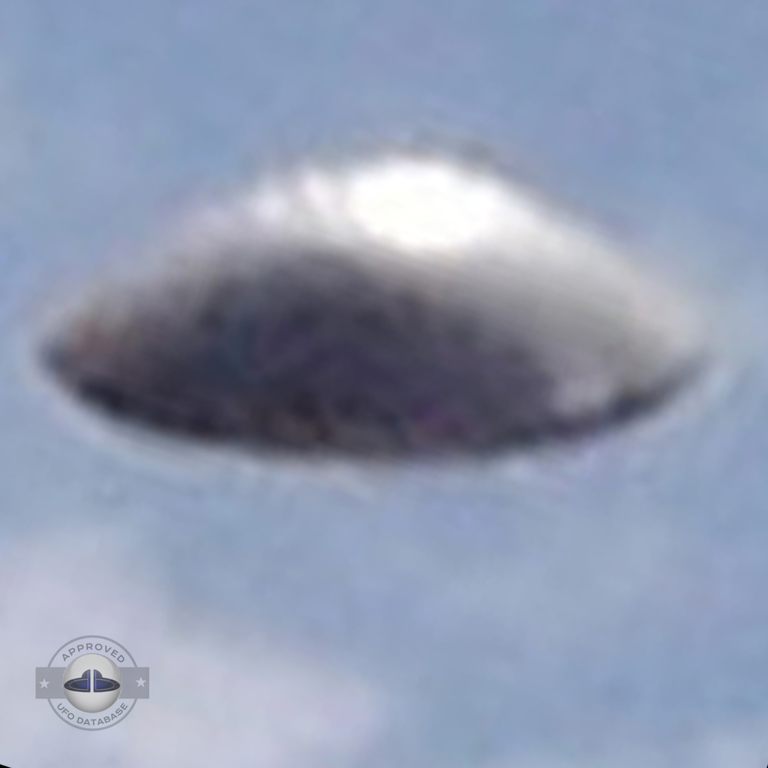 UFO with silver dome shape in clear blue sky. UFO picture Alagamar UFO Picture #86-5
