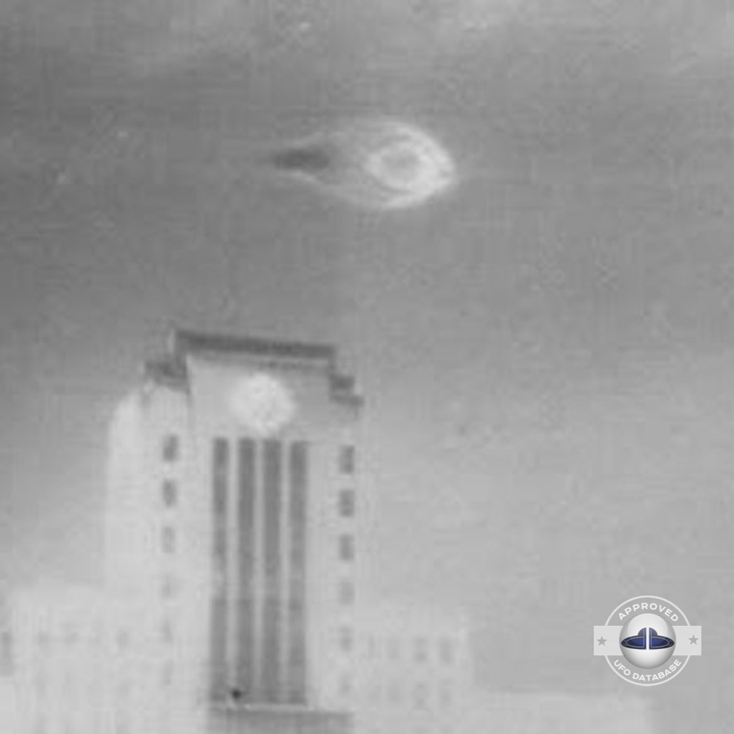UFO moved straight in the sky stopping over flagpole of the city hall UFO Picture #87-3