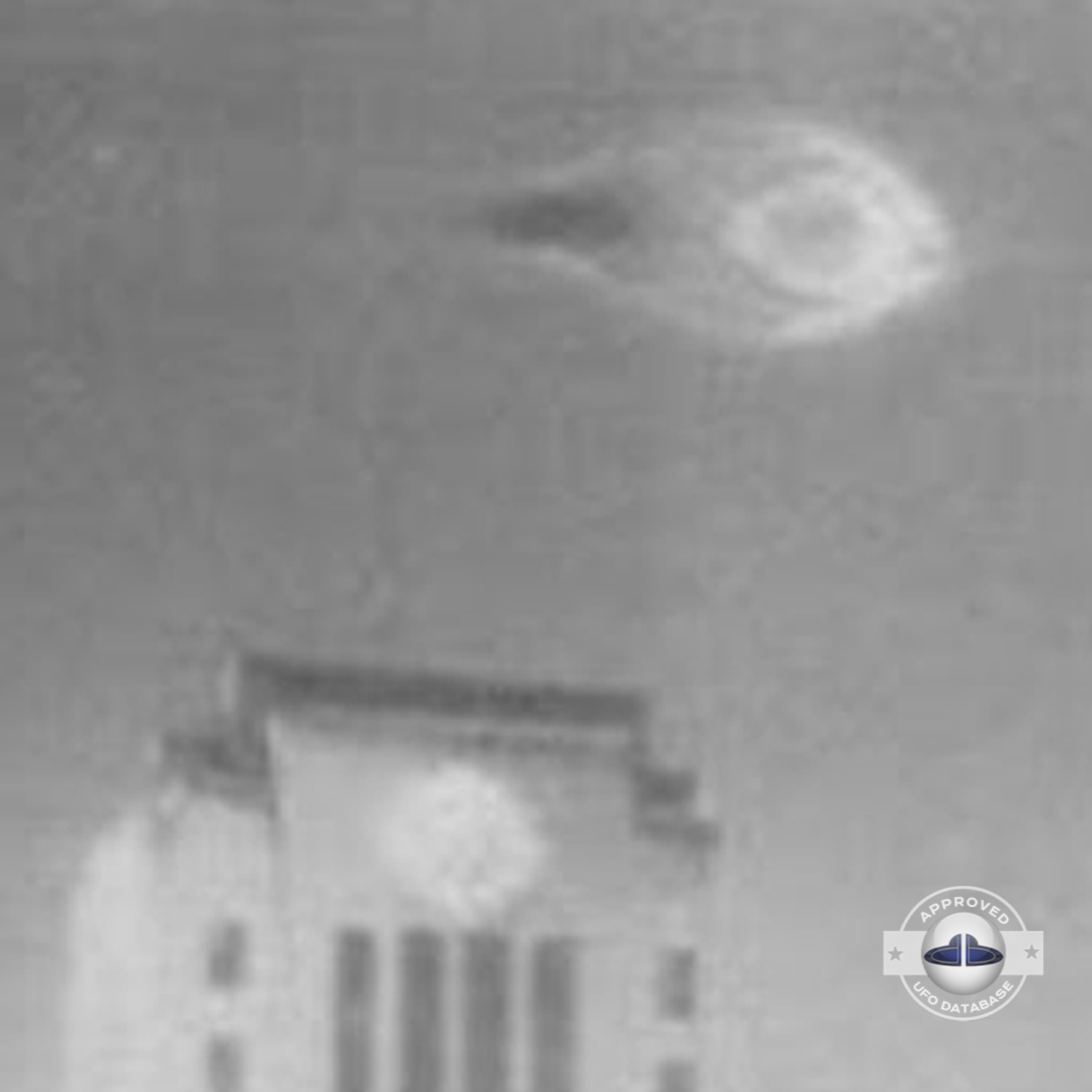 UFO moved straight in the sky stopping over flagpole of the city hall UFO Picture #87-4