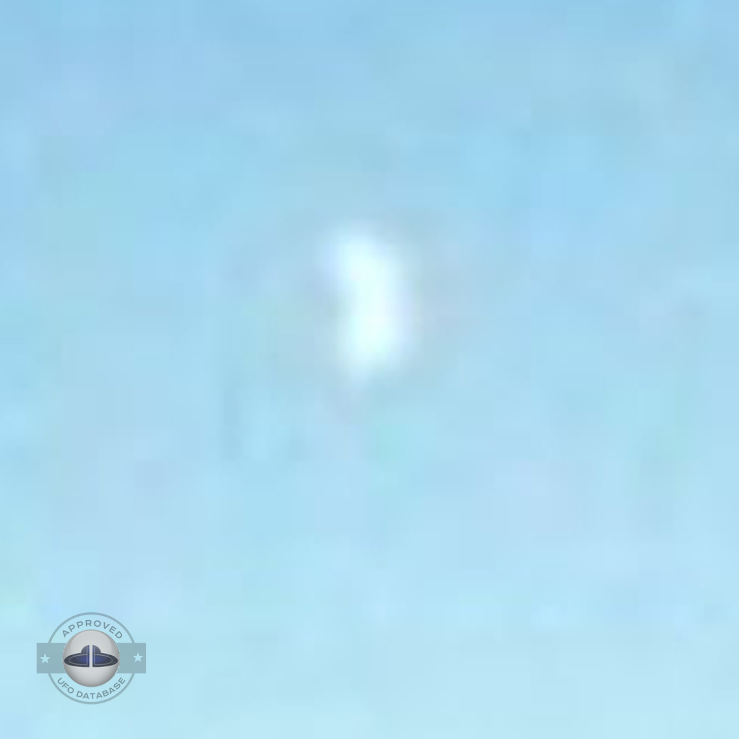 UFO flying over dark blue water near the shore of Lake Michigan USA UFO Picture #97-4