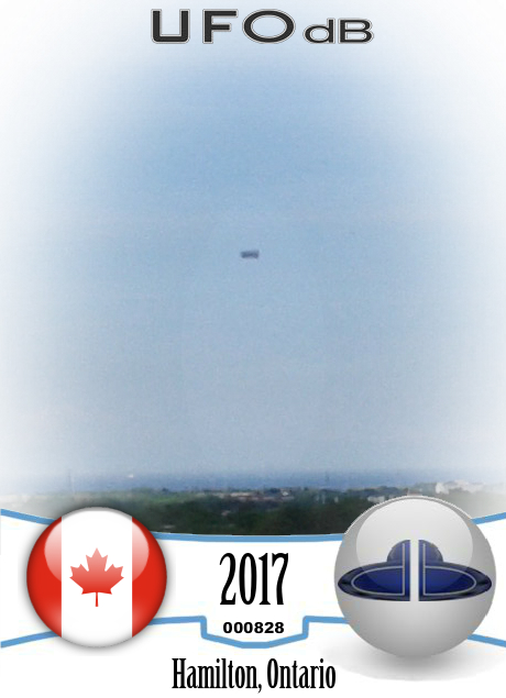 3D rectangular box-shaped UFO drifting smoothly - Hamilton Ontario Can UFO CARD Number 828