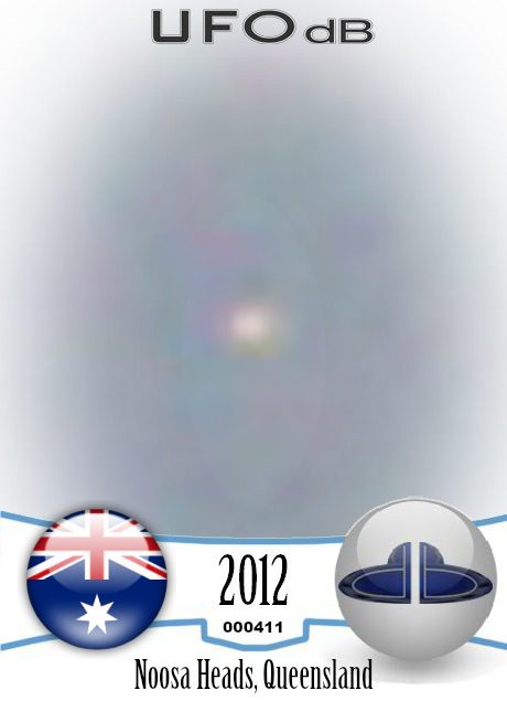 Bird photo captures two UFOs passing near Noosa Heads, Australia 2012 UFO CARD Number 411