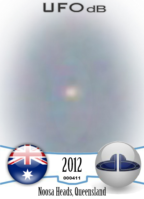 Bird photo captures two UFOs passing near Noosa Heads, Australia 2012 UFO CARD Number 411