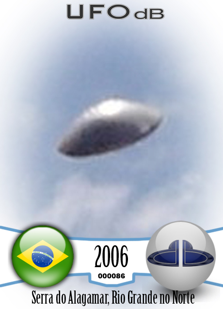UFO with silver dome shape in clear blue sky. UFO picture Alagamar UFO CARD Number 86