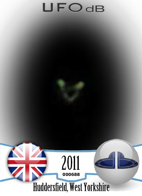 Circular UFO with 2 glowing green lights seen in Huddersfield UK 2011 UFO CARD Number 688