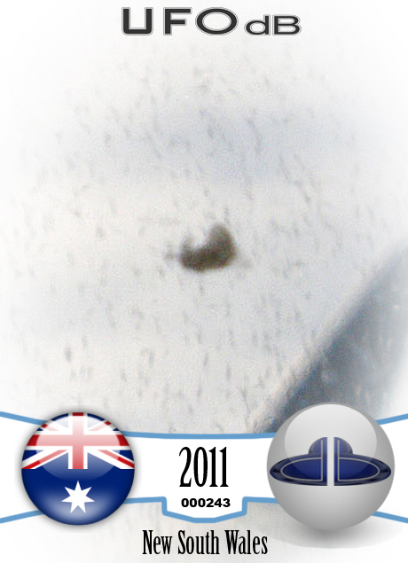Cloaking UFO near wing of flying Airplane in Australia | January 2011 UFO CARD Number 243