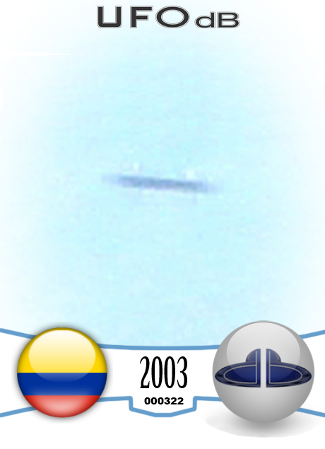 Colombia Saucer flying over the hills caught on picture | March 3 2003 UFO CARD Number 322