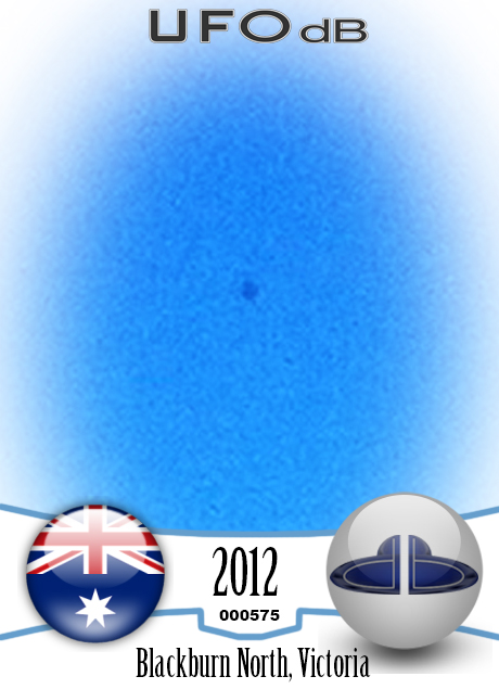 Donut Shaped UFO in blue sky over Blackburn North, Australia in 2012 UFO CARD Number 575
