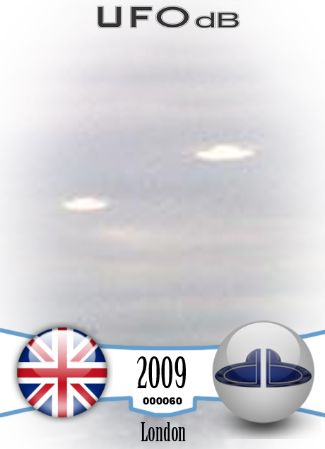 UFO picture we can see 4 white rounds coming out of the grey clouds UFO CARD Number 60