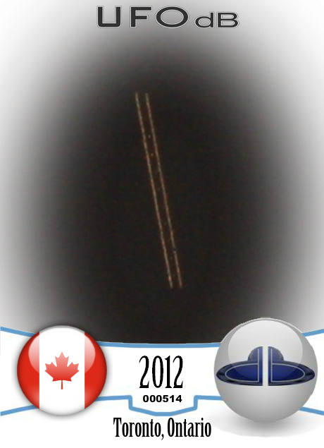 Long UFO ship in the space caught on picture over Toronto Ontario 2012 UFO CARD Number 514
