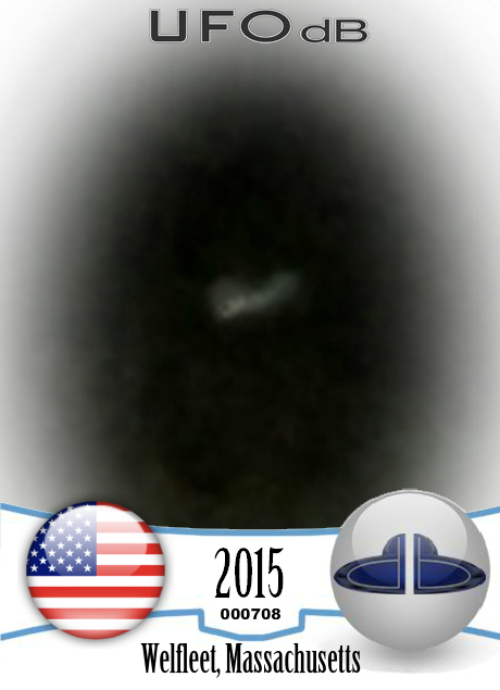 Looked like mothership with smaller glowing craft flying around it in  UFO CARD Number 708