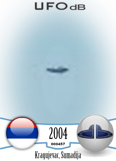 Monument picture reveals passing saucer UFO in Kragujevac, Serbia 2004 UFO CARD Number 457