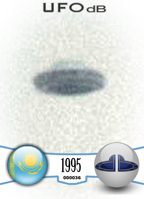 UFO picture showing UFO over snowy mountains during the day UFO CARD Number 36
