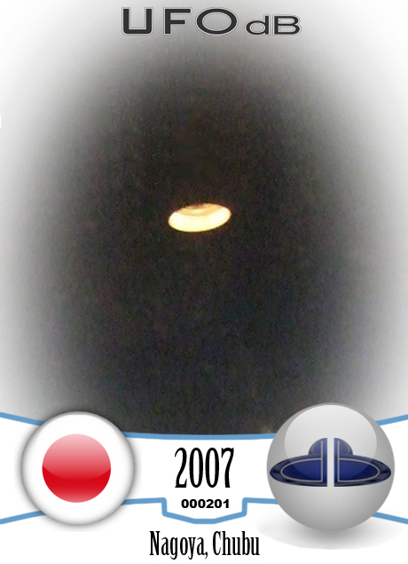Light Orange glowing UFO saucer over Nagoya, Chubu | Japan 2007 UFO CARD Number 201